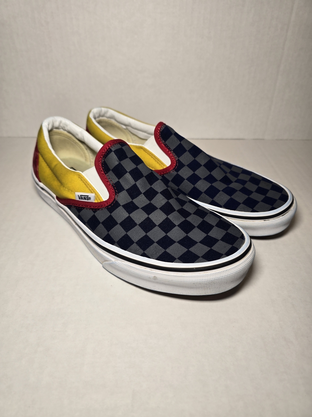 Vans Checkerboard Slip-On Sneakers in Black, Yellow & Red